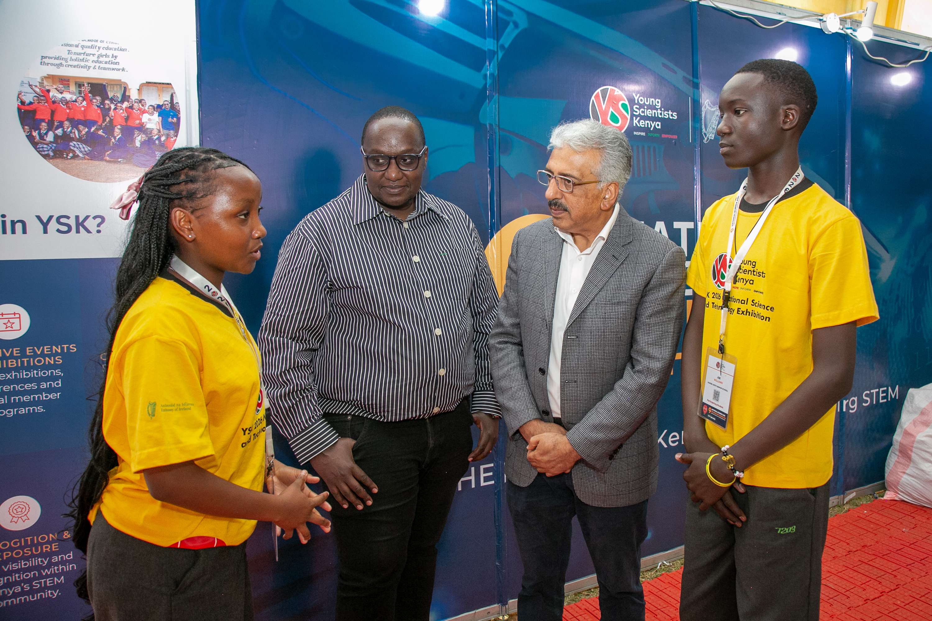 Grace Wanjiru of St. Mary’s Girls School in Nakuru County, Dr. Victor Mwongera, National Director of Young Scientists Kenya, Mahboob Bajwa, Deputy Representative for Programmes at UNICEF Kenya, and Joe Williams of Nakeel Boys School in Kajiado County engage in a discussion about the students’ project during the ninth Young Scientists Kenya National Science and Technology Exhibition at Moi Girls High School in Nairobi.