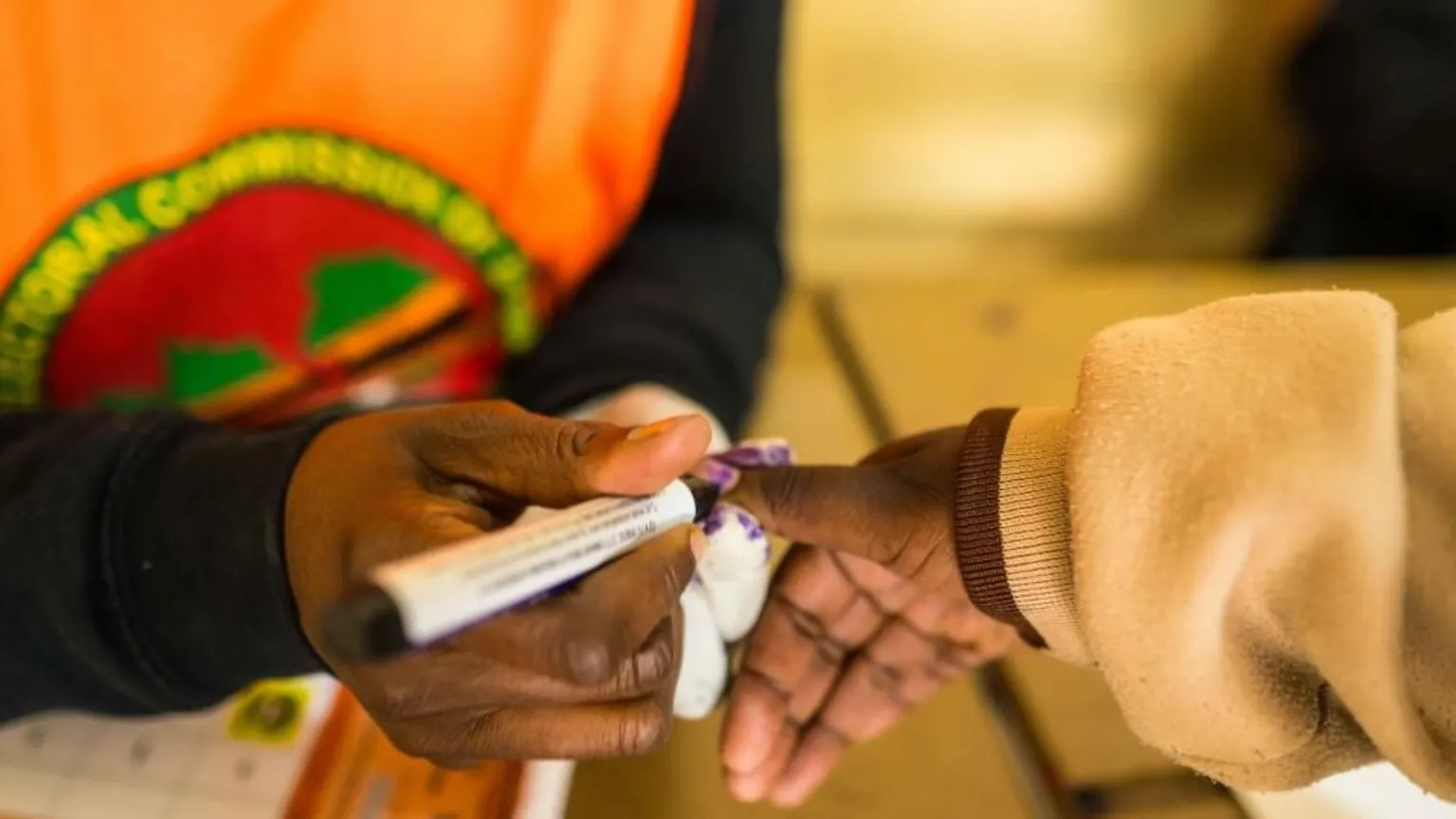 Officials marked voters' thumbnails with indelible ink to make sure they do not try to vote again