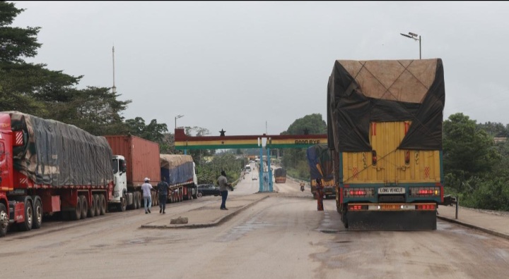 Cargo trucks crossing African borders illustrate the practical infrastructure behind continental trade.