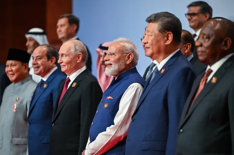 Russia's President Vladimir Putin (3L), India's Prime Minister Narendra Modi (3R) and China's President Xi Jinping (2R) posing with other leaders for a family photo during the 18th BRICS Summit in New Delhi on September 13, 2026 [Handout/ Indian Press Information Bureau (PIB) shows (Photo by Handout / Indian Press Information Bureau via AFP) At BRICS Summit 2026