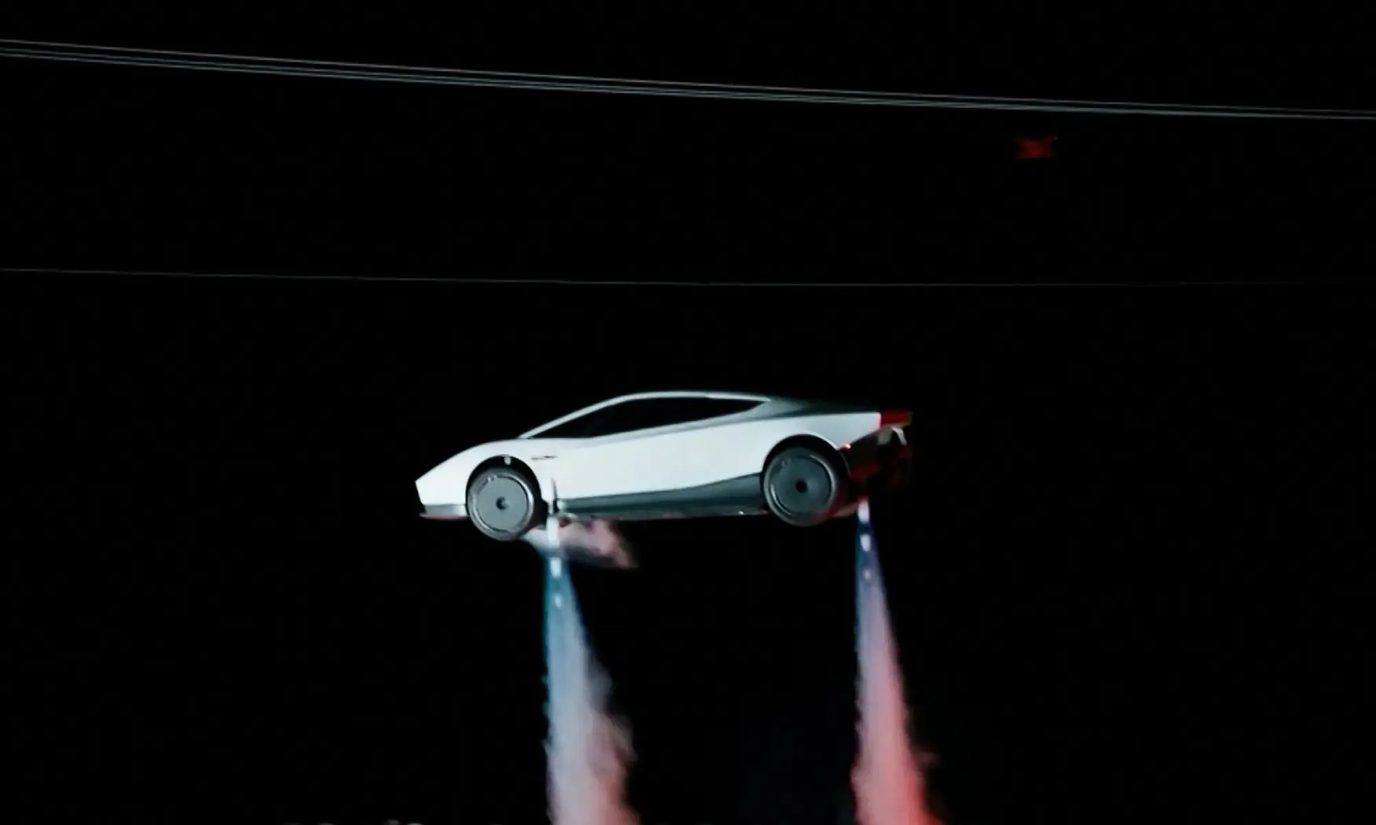 During the demonstration, the driverless Roadster climbed a steep ramp using suction technology beneath the vehicle, hung upside down and spun off the structure before using air jets to land.